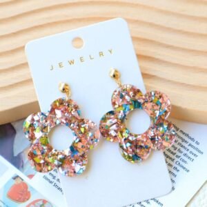 1 paire de boucles d’oreilles à fleurs ajourées pailletées
