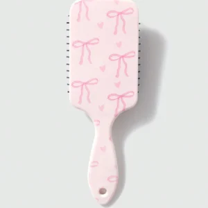 Peigne-coussin nœud papillon rose
