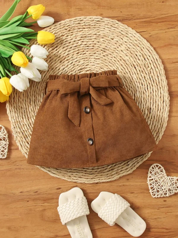 Jupe faux bouton ceinturée