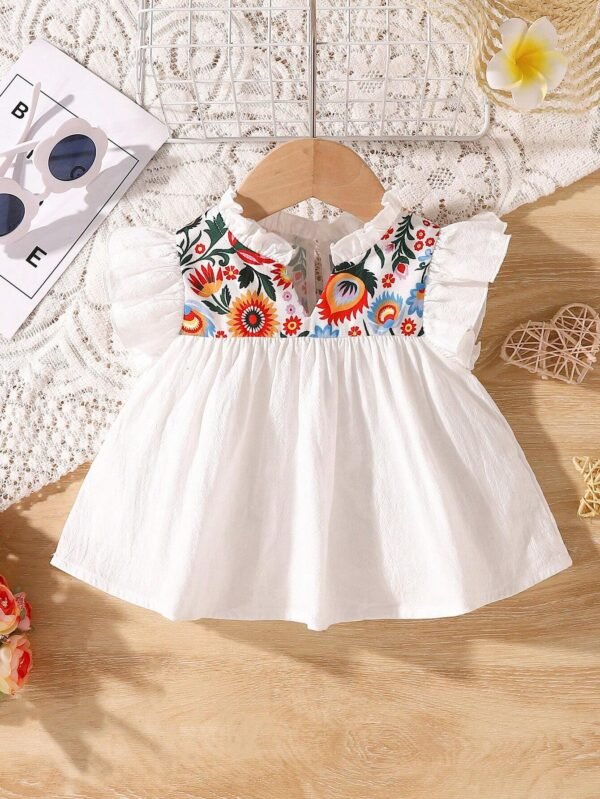 Top sans manches fleurs volants