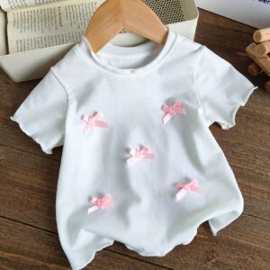 Top tricot rose blanc volants