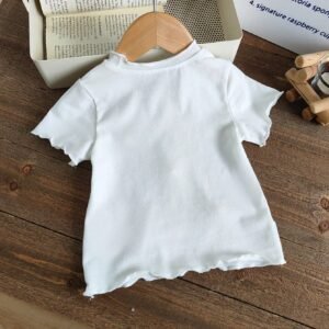 Top tricot rose blanc volants